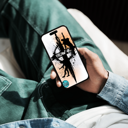 Young man holding smartphone with Christian lockscreen wallpaper displaying “Follow Me” cross design from Matthew 16:24–26.