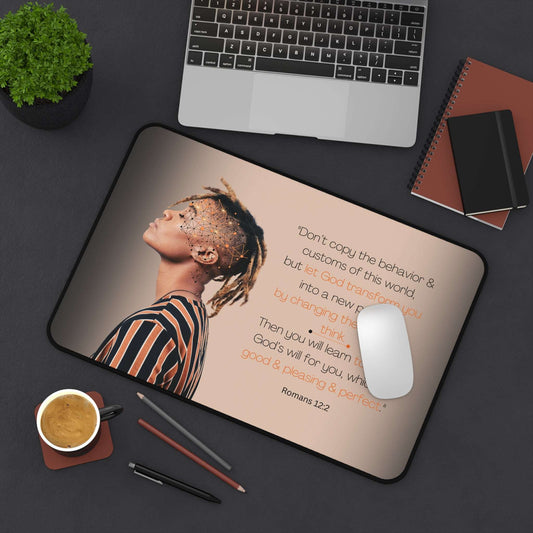 Romans 12:2 - 'Let God Transform You' Christian Desk Mat 12 x 18 Top View in Use on Desk next to laptop and office utensils.