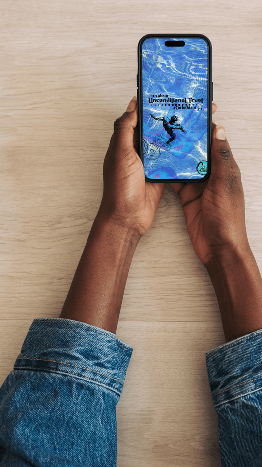 Person holding a smartphone with the Unconditional Trust design as their Phone lockscreen.