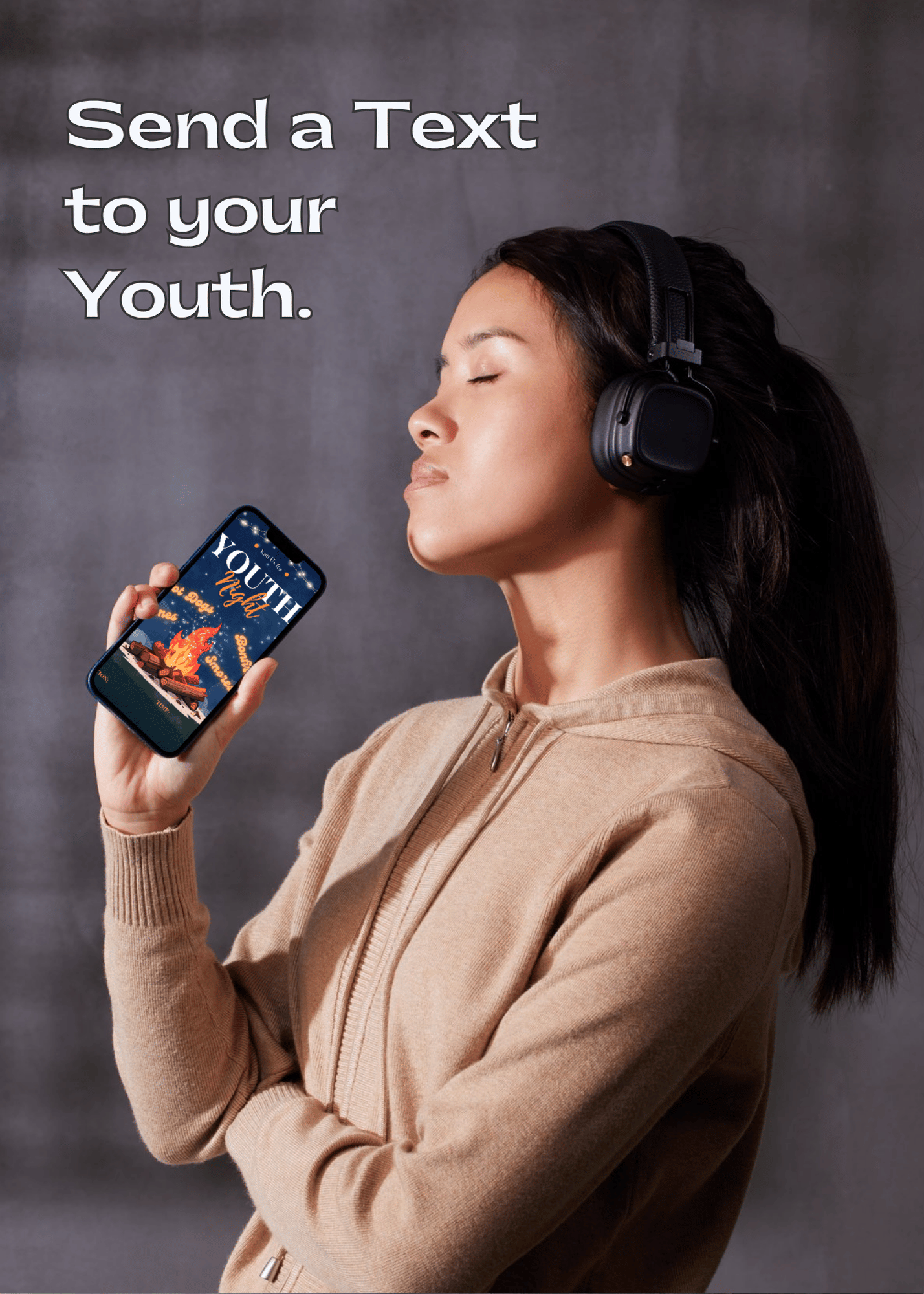 Teenage girl wearing headphones and holding a phone with a text reminder of the "Youth Bonfire Night" customized by her youth ministry, with a dark background