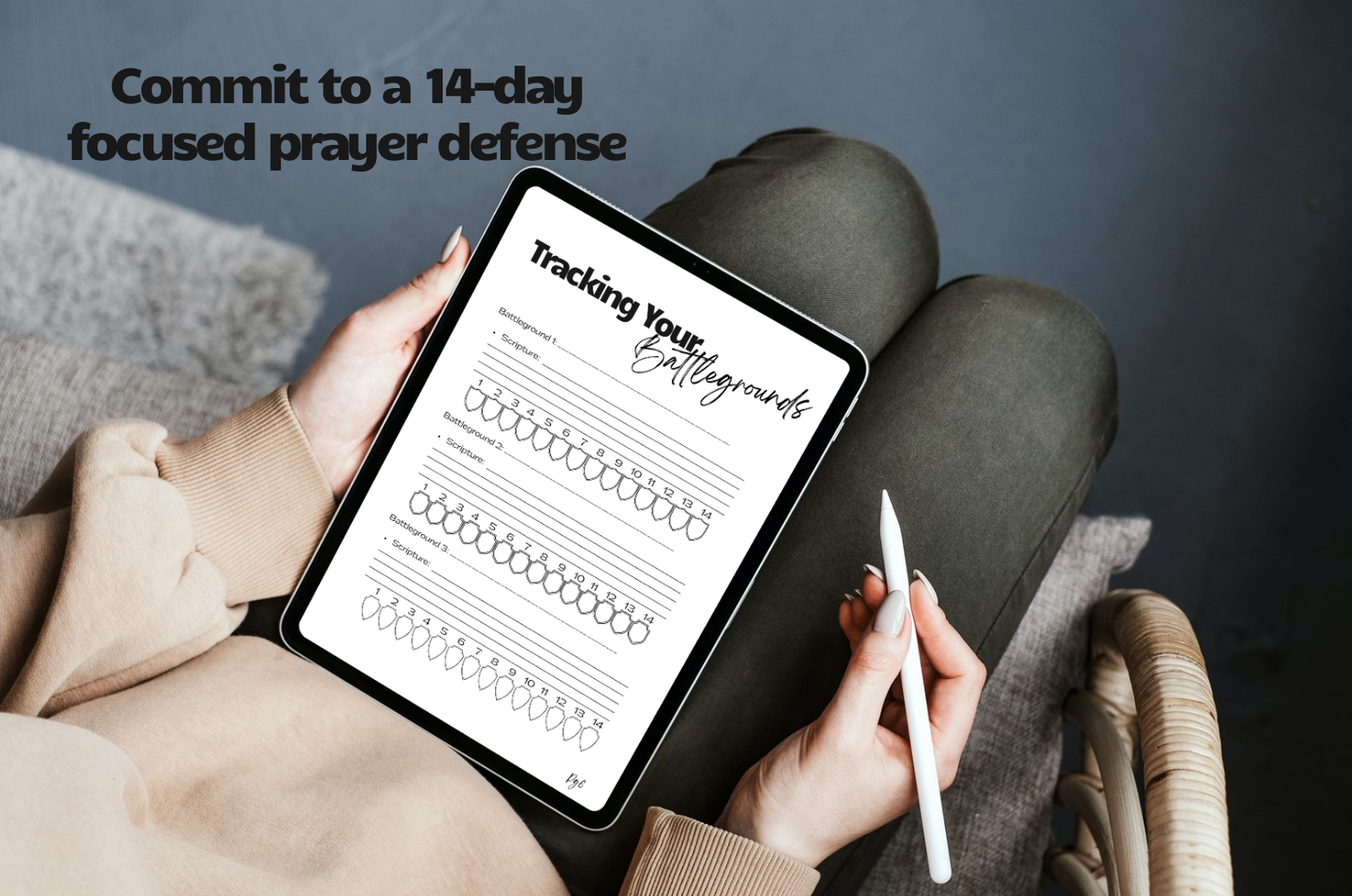 Person holding a tablet with a prayer tracking app on a dark background. Overlay text says: Commit to a 14 day focused prayer defense.