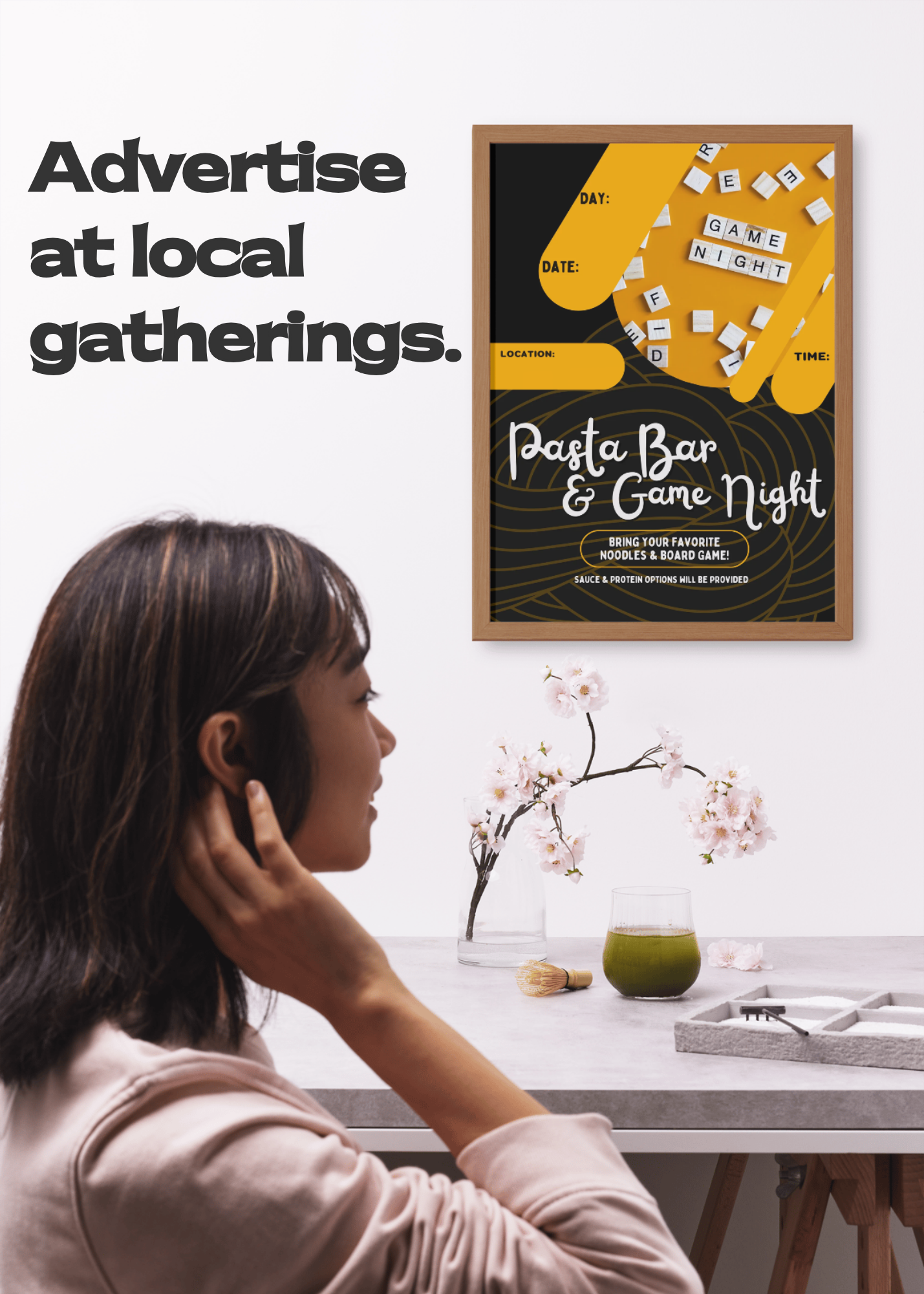 Young woman noticing the event poster for a Pasta Bar & Game Night event on the wall above her.