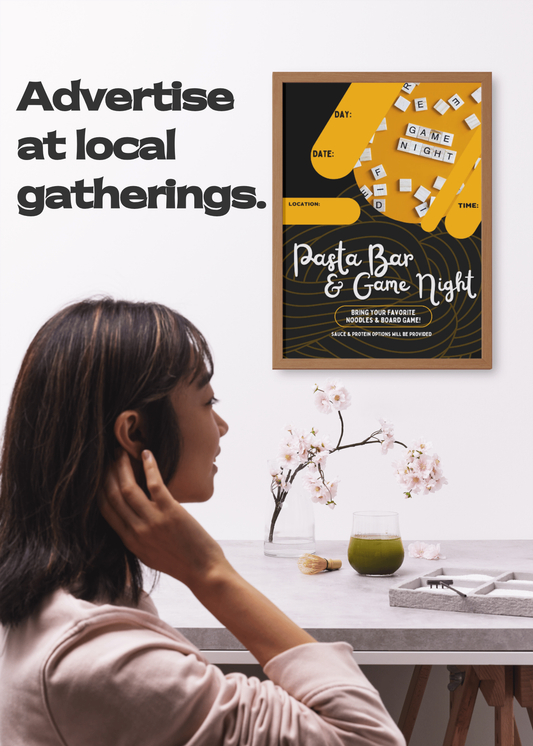 Young woman noticing the event poster for a Pasta Bar & Game Night event on the wall above her.