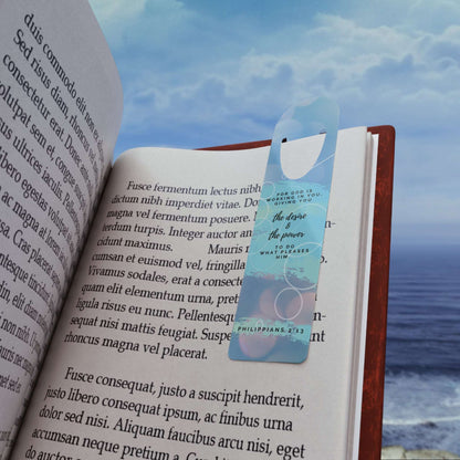 Philippians 2:13 'For God is Working in You' Christian Bookmark Front view in use on example book page on the beach.