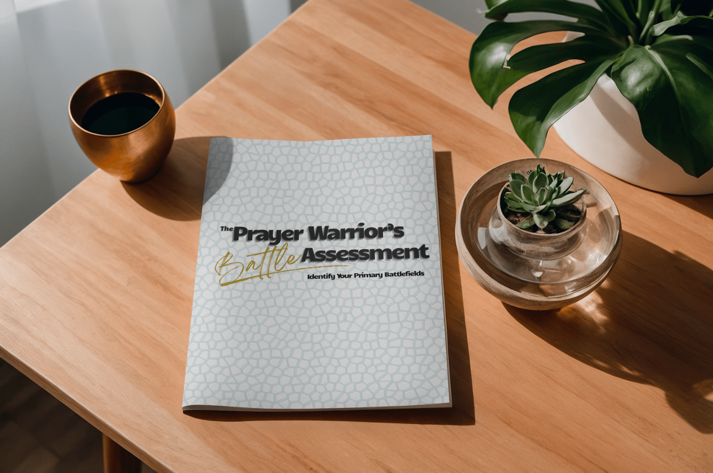 Free downloadable titled 'The Prayer Warrior's Assessment' on a wooden table with a plant and cup.