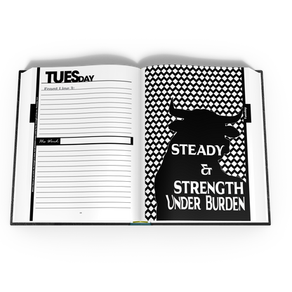 Open notebook with lined pages and a black and white tracker design