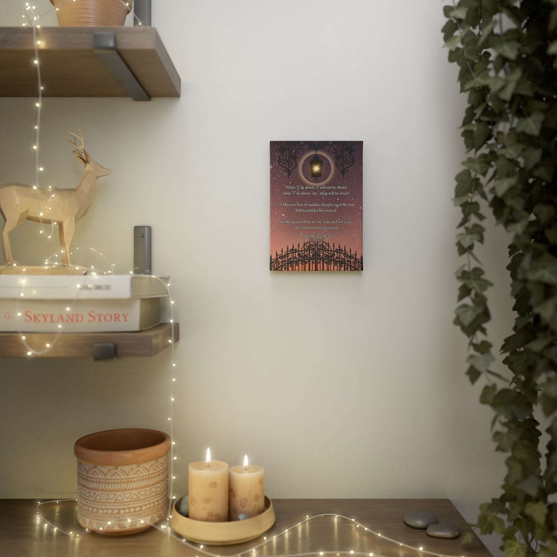 Proverbs 3:24-26 - 'When I lie down, I will not be afraid' Christian Canvas Wall Art 5x7 product size example, hanging on wall beside decorated shelves