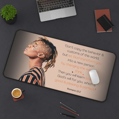 Romans 12:2 - 'Let God Transform You' Christian Desk Mat Top View in Use on Desk next to laptop and office utensils.