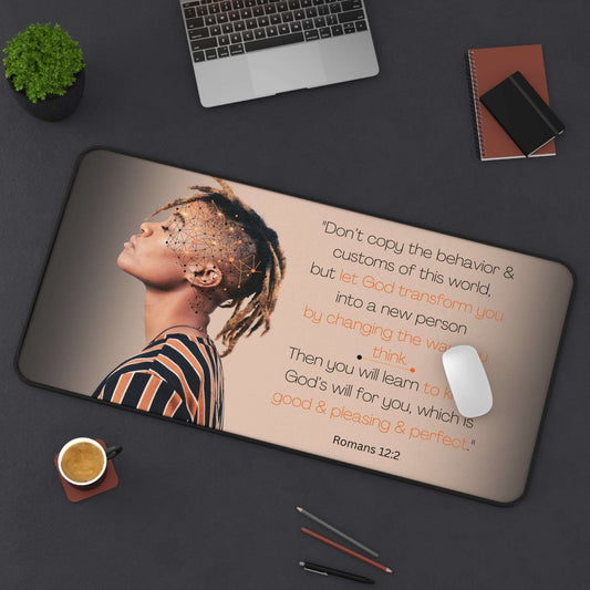 Romans 12:2 - 'Let God Transform You' Christian Desk Mat Top View in Use on Desk next to laptop and office utensils.