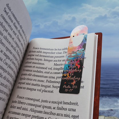 The Bible verse page marker Everlasting to Everlasting, inspired by Psalm 103:15–17, is clipped securely to a book page and held in front of a soft beach background. A Christian bookmark made for Bible study, devotionals, or gifting—mark the moment you didn’t quit trusting Him.