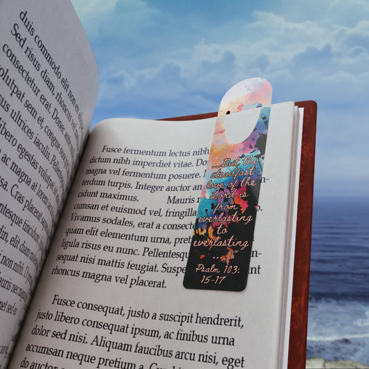 The Bible verse page marker Everlasting to Everlasting, inspired by Psalm 103:15–17, is clipped securely to a book page and held in front of a soft beach background. A Christian bookmark made for Bible study, devotionals, or gifting—mark the moment you didn’t quit trusting Him.