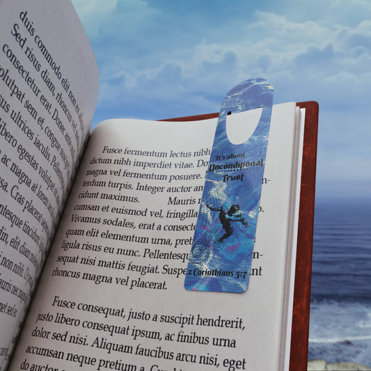 The Bible verse page marker Unconditional Trust, inspired by 2 Corinthians 5:7, is clipped securely to a book page and held in front of a soft beach background. A Christian bookmark made for Bible study, devotionals, or gifting—mark the moment you didn’t quit trusting Him.